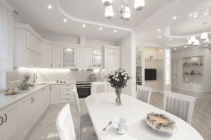 Белая кухня в интерьере гостиной