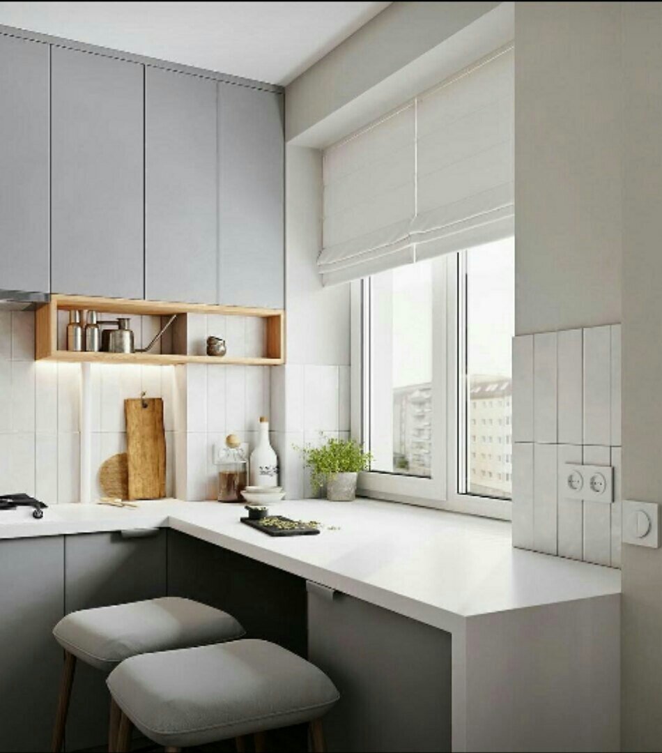 Планировка небольшой угловой кухни у окна