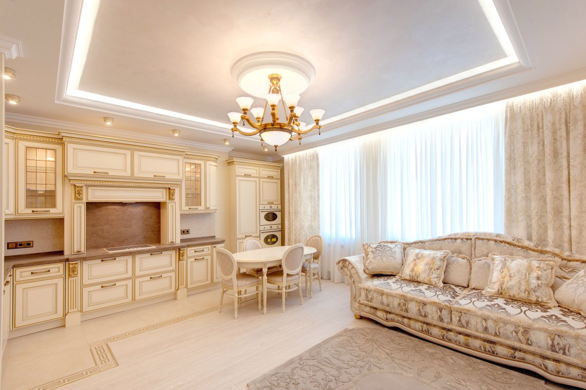 Кухня гостиная в бело золотом цвете